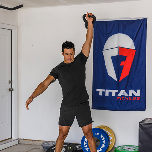 Male using a kettlebell