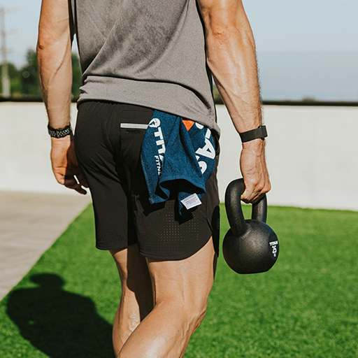 Person holding a kettlebell