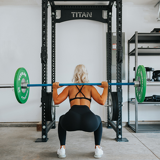 Person squatting in a squat stand