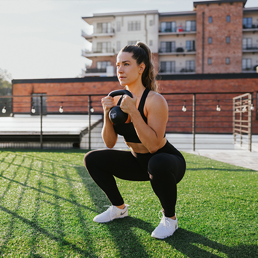 Person doing kettlebell squats