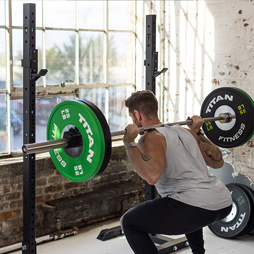 Person squatting in a squat stand